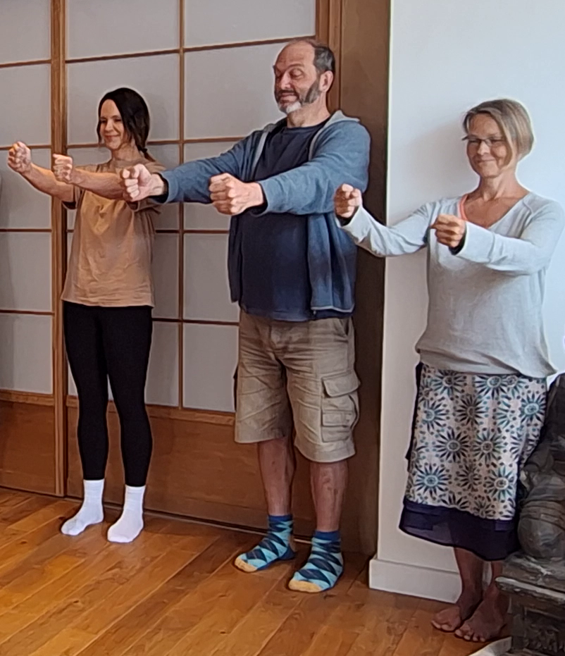 Imagination Exercise. Think of your right hand being light and your left hand being heavy. Four people demonstrate the results.