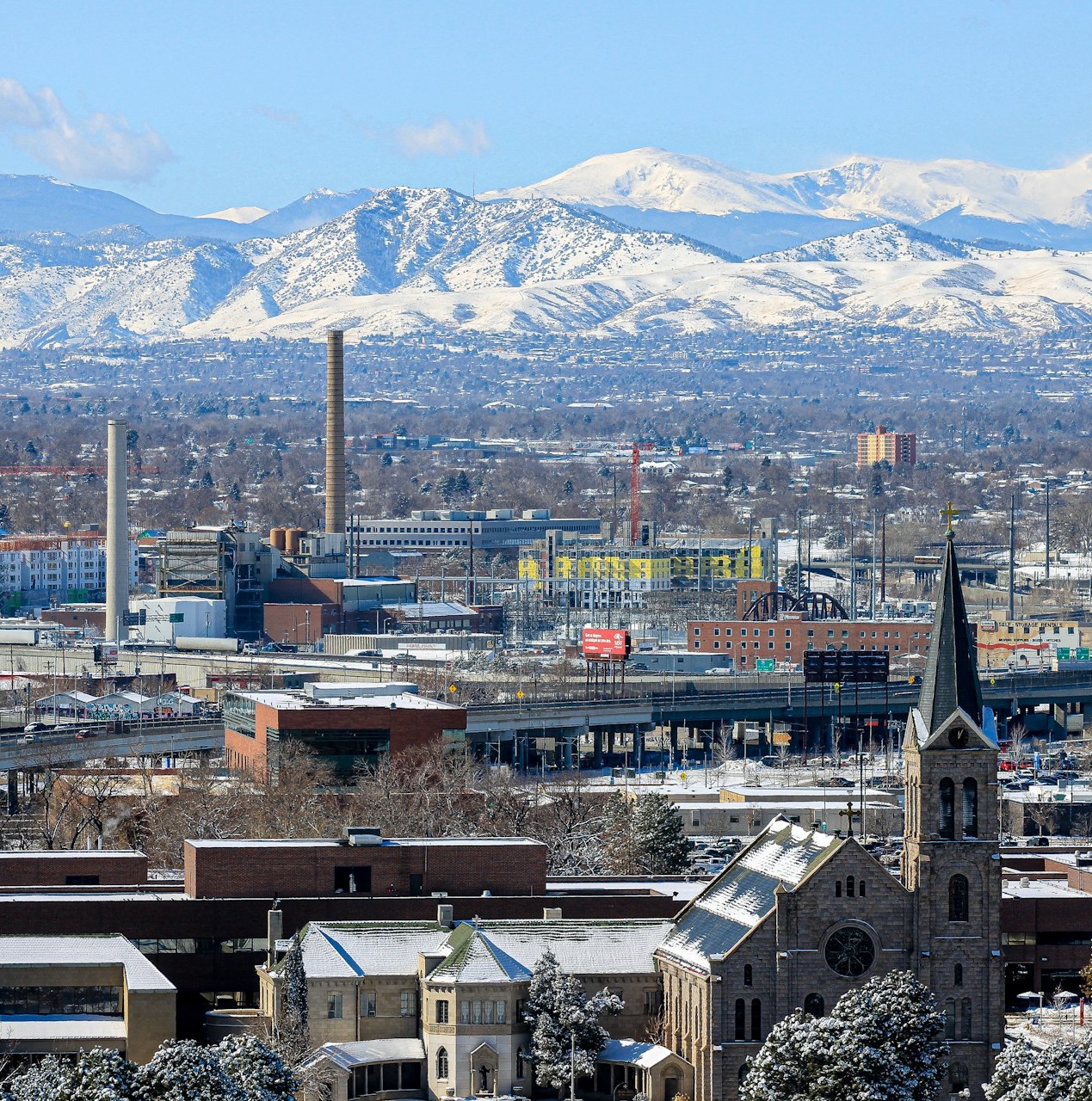 Denver City skyline, looking towards the Rockies. Denver is a mile above sea level.