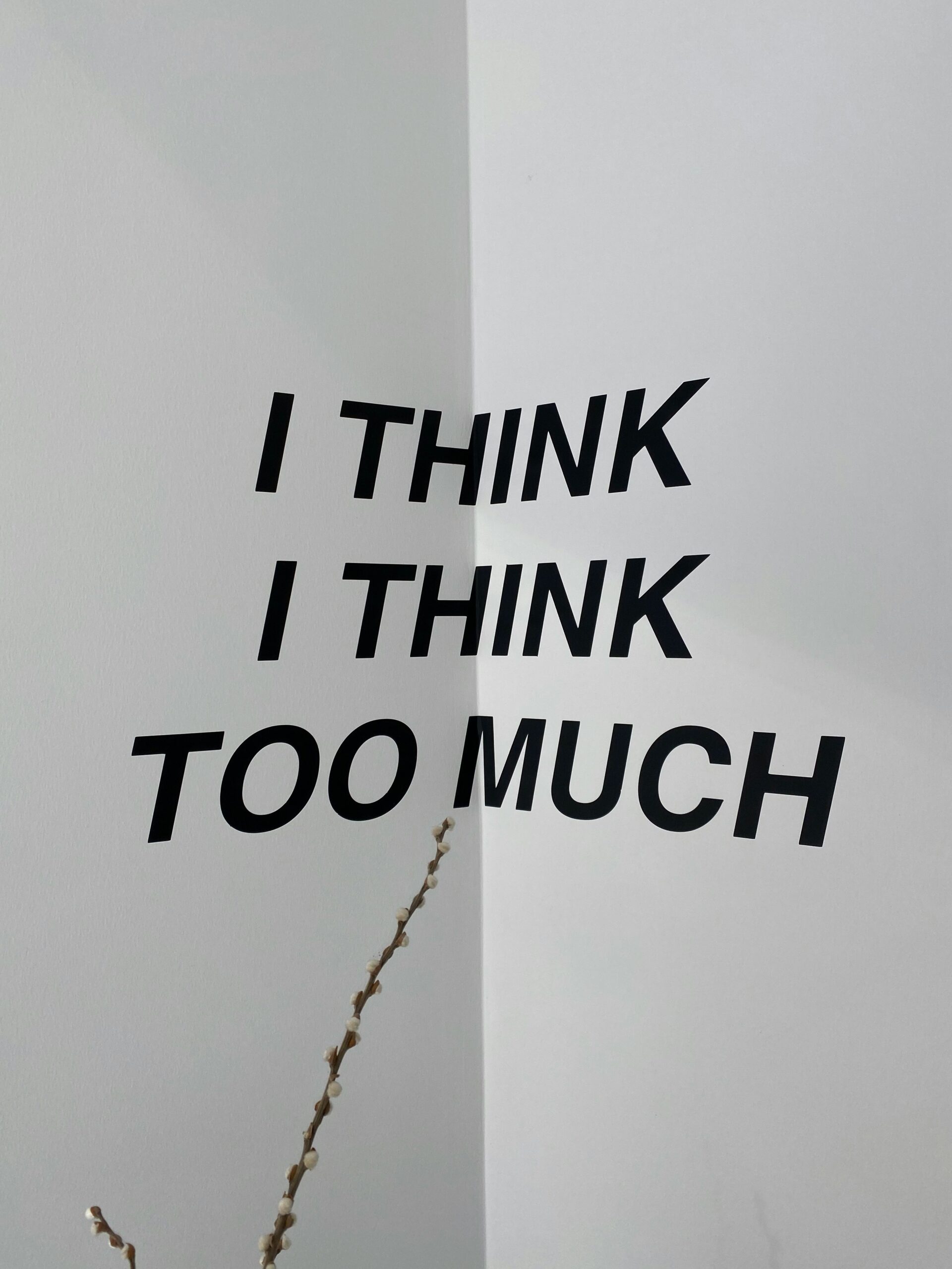 Piece of paper saying "I think I think too much"